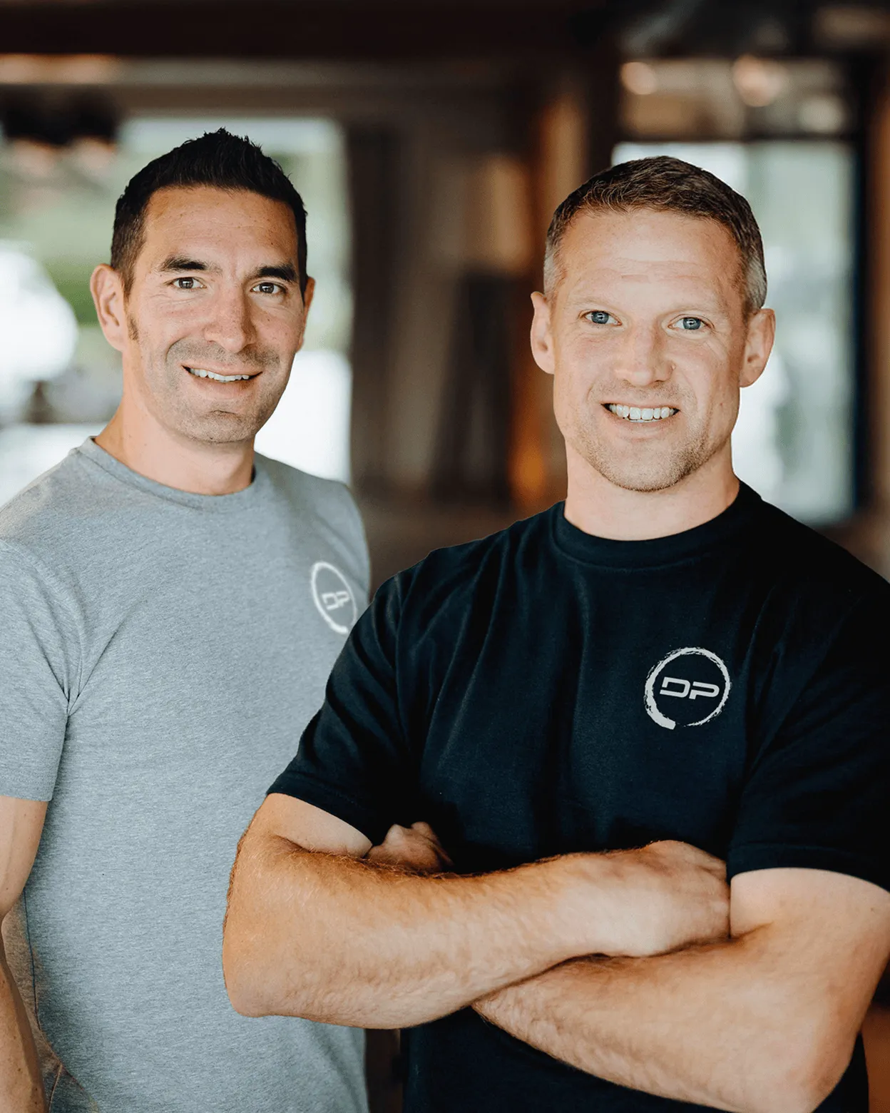 Devenir Plus owners Chris and Tsen looking at the camera and smiling.