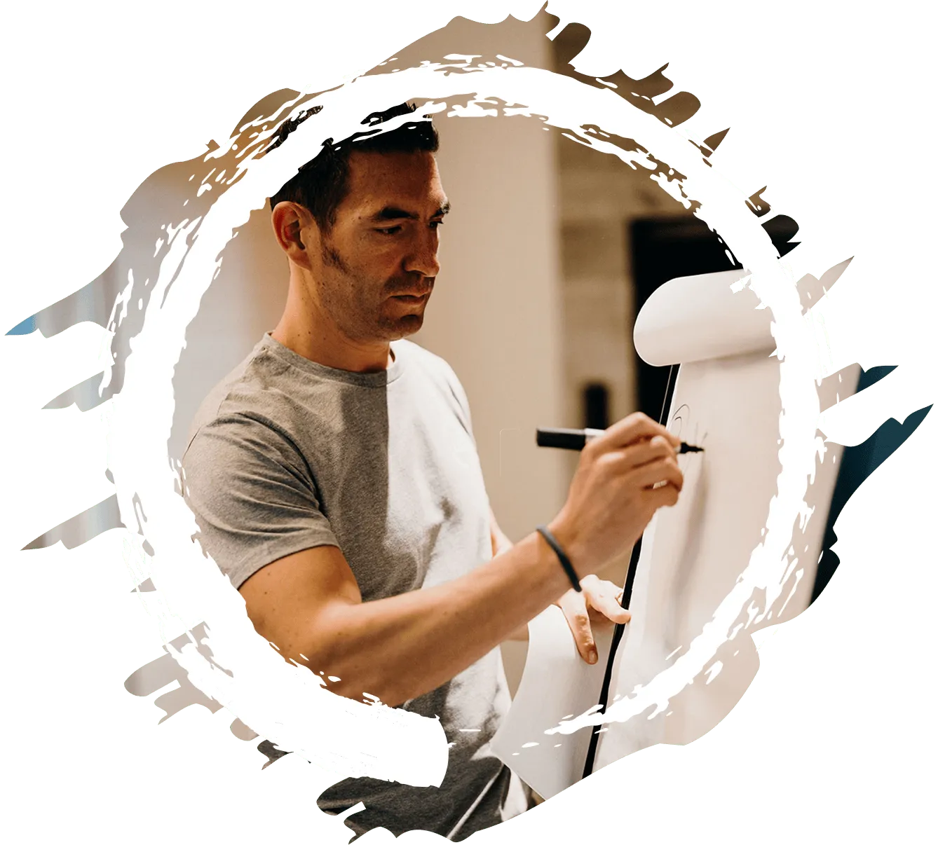 Tsen writing on a whiteboard during a workshop