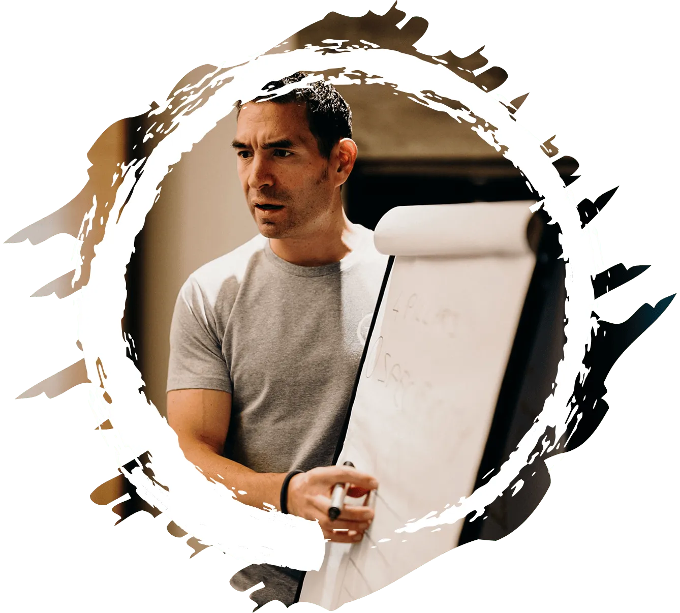 Tsen standing next to a whiteboard giving a workshop