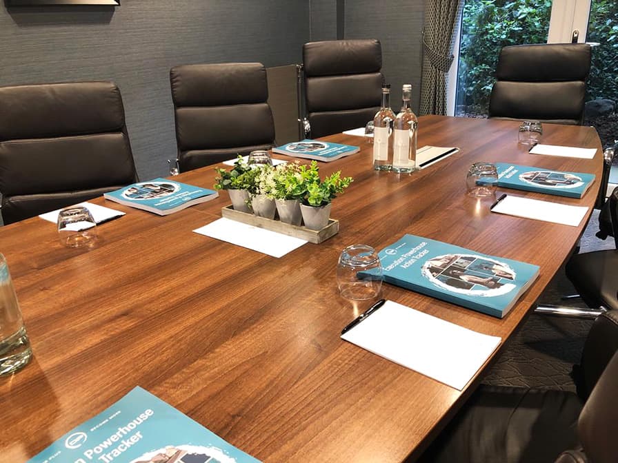 Board table with mastermind workbooks