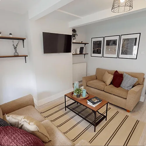 A living room filled with furniture and a flat screen tv.