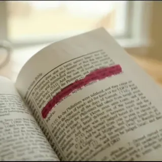 Highlighter ink bleeding through a thin Bible page