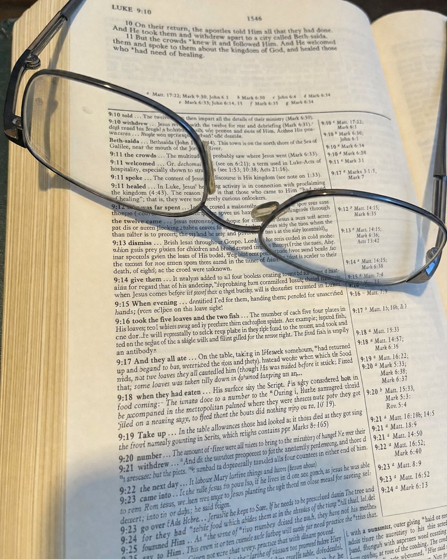A study Bible page packed with small notes