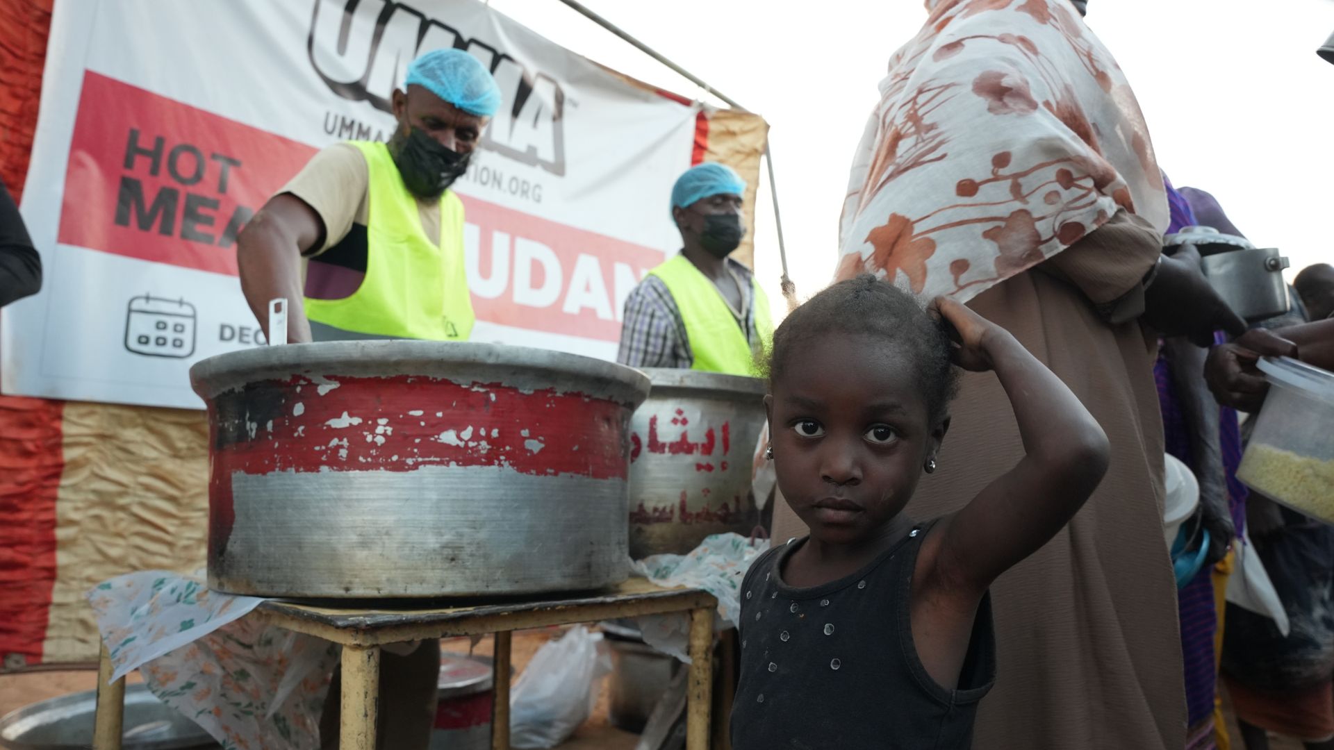 humanitarian aid meal distribution providing hot food to families in need