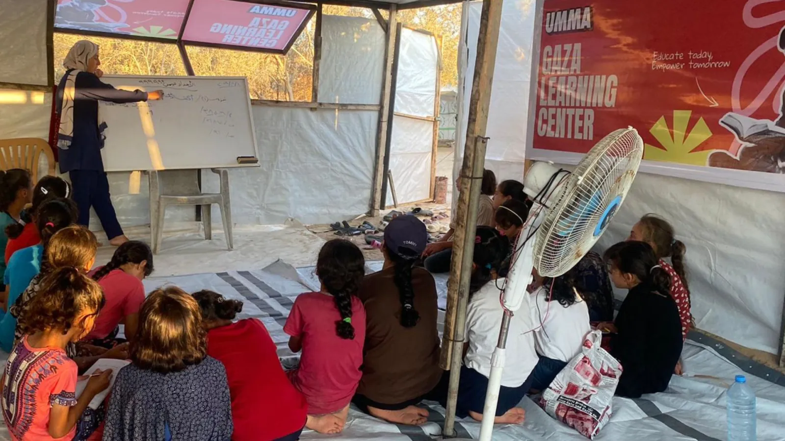 Children learning and reading together in educational program