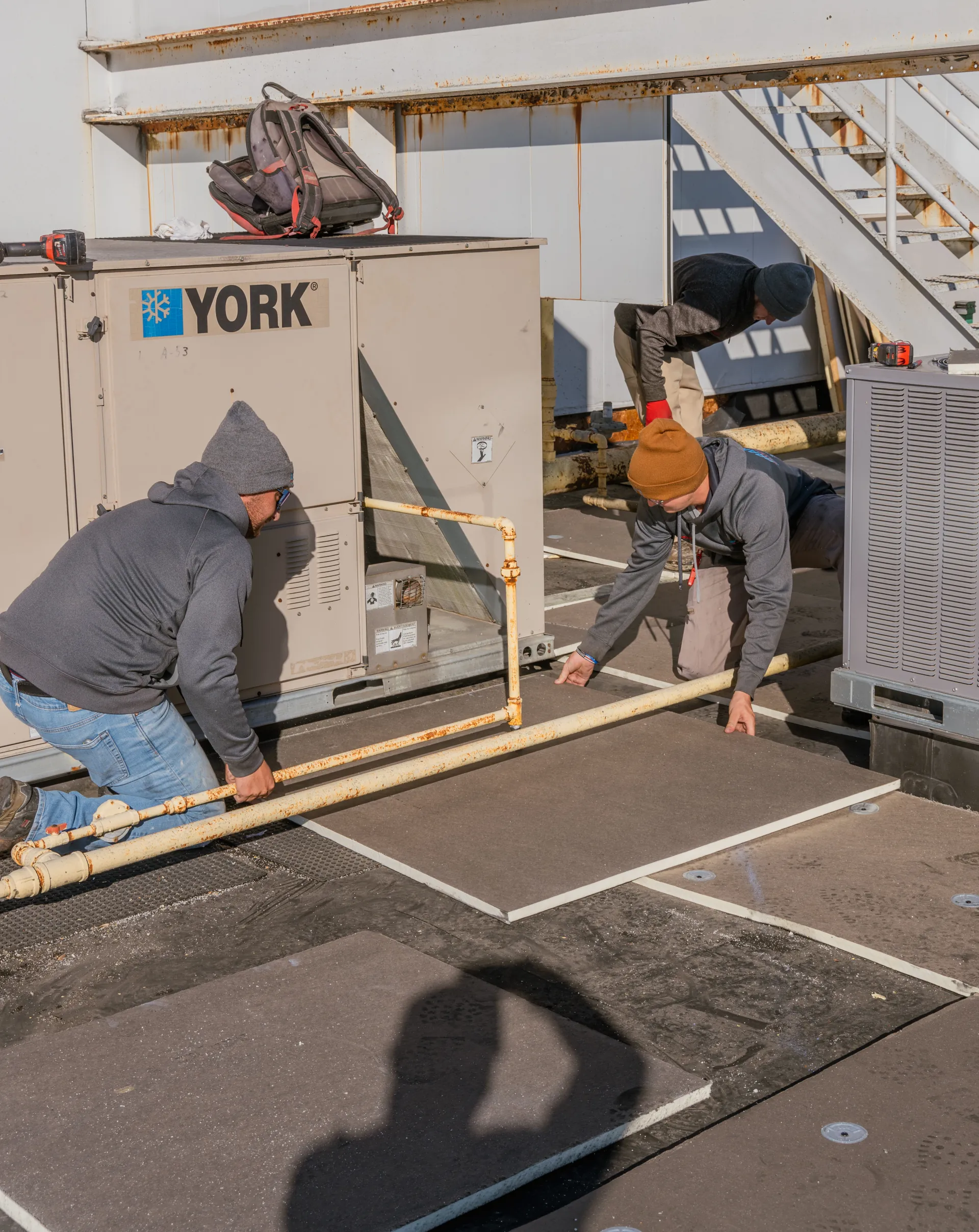 2 men inspecting a commercial roof