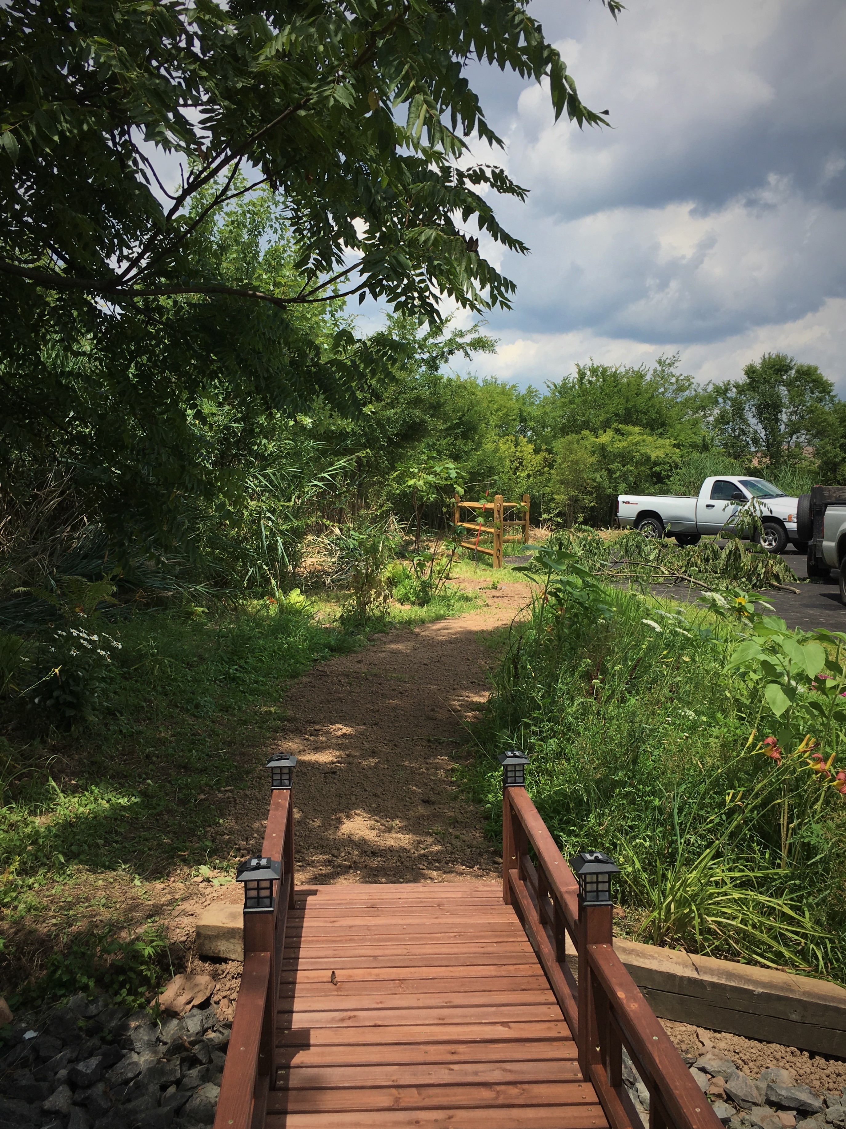 Side walking path with wooden bridge