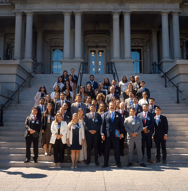 A group of people standing in front of a building.