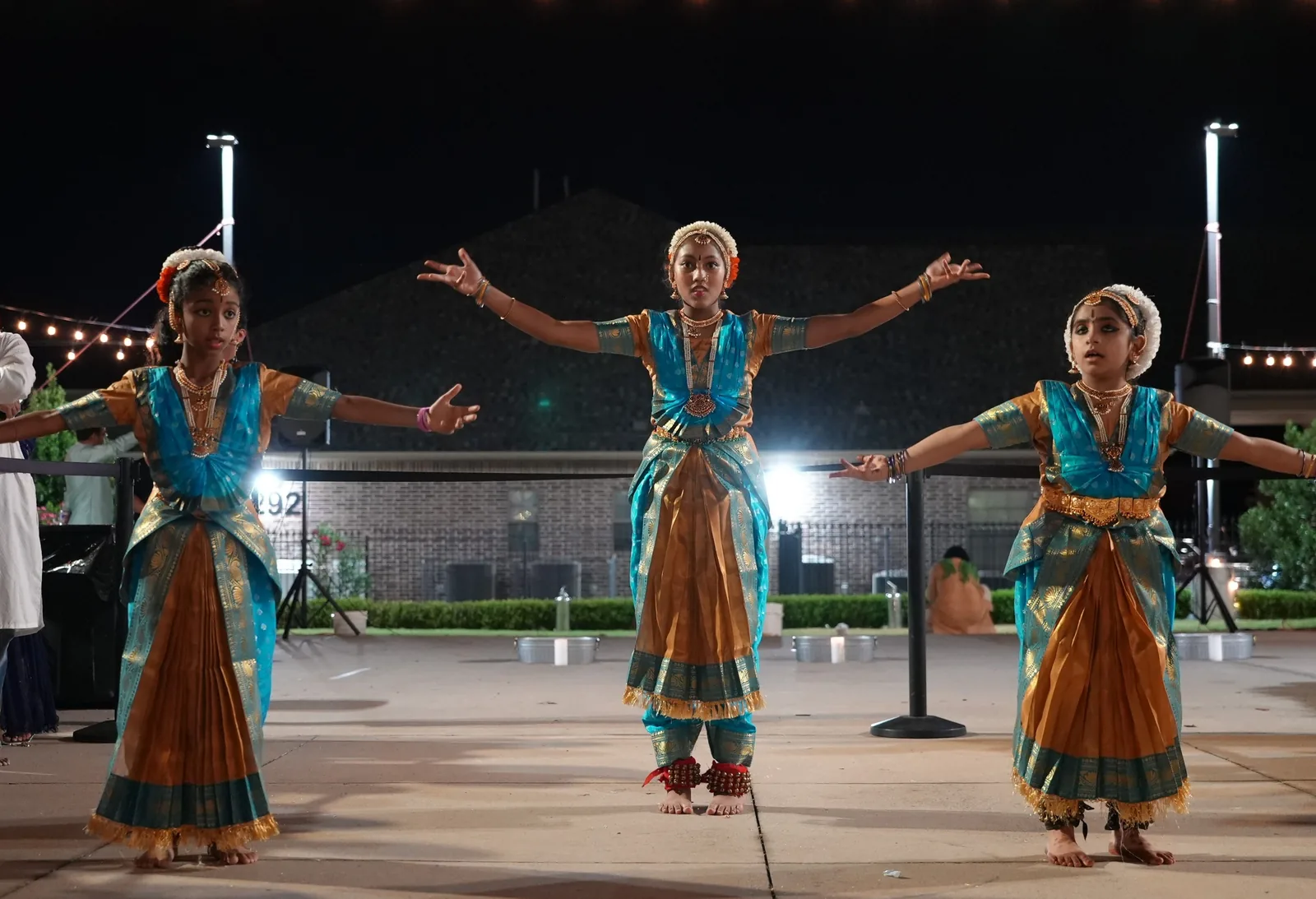 Young dancers performing in the temple courtyard at dusk