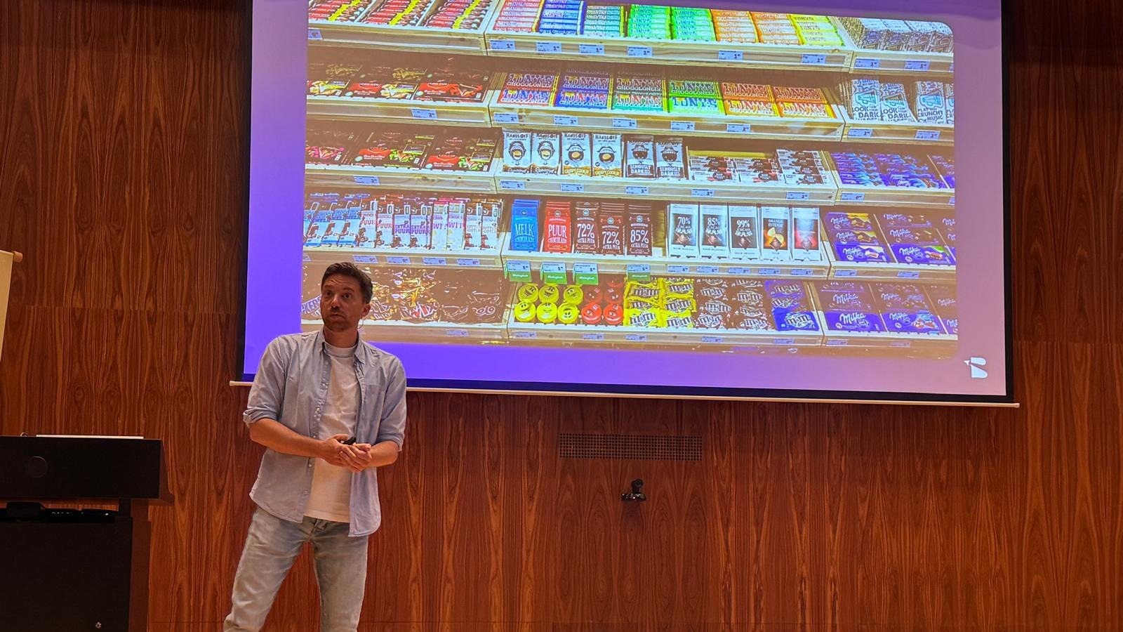 Speaker on stage at the kick-off of the PGGM Data & AI Academy