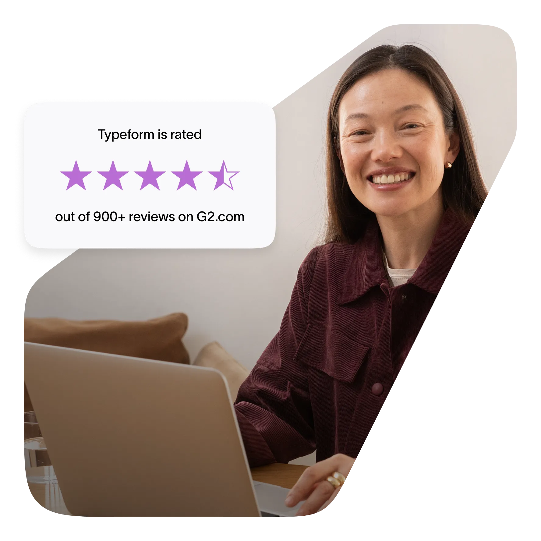 Smiling woman at laptop with Typeform G2 rating badge showing 4.5 stars from over 900 reviews