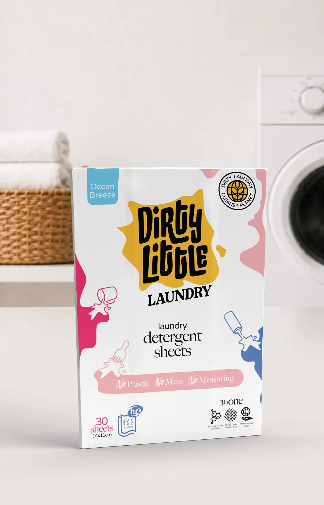 Ambalaj Dirty Little Laundry prezentat lângă mașina de spălat.