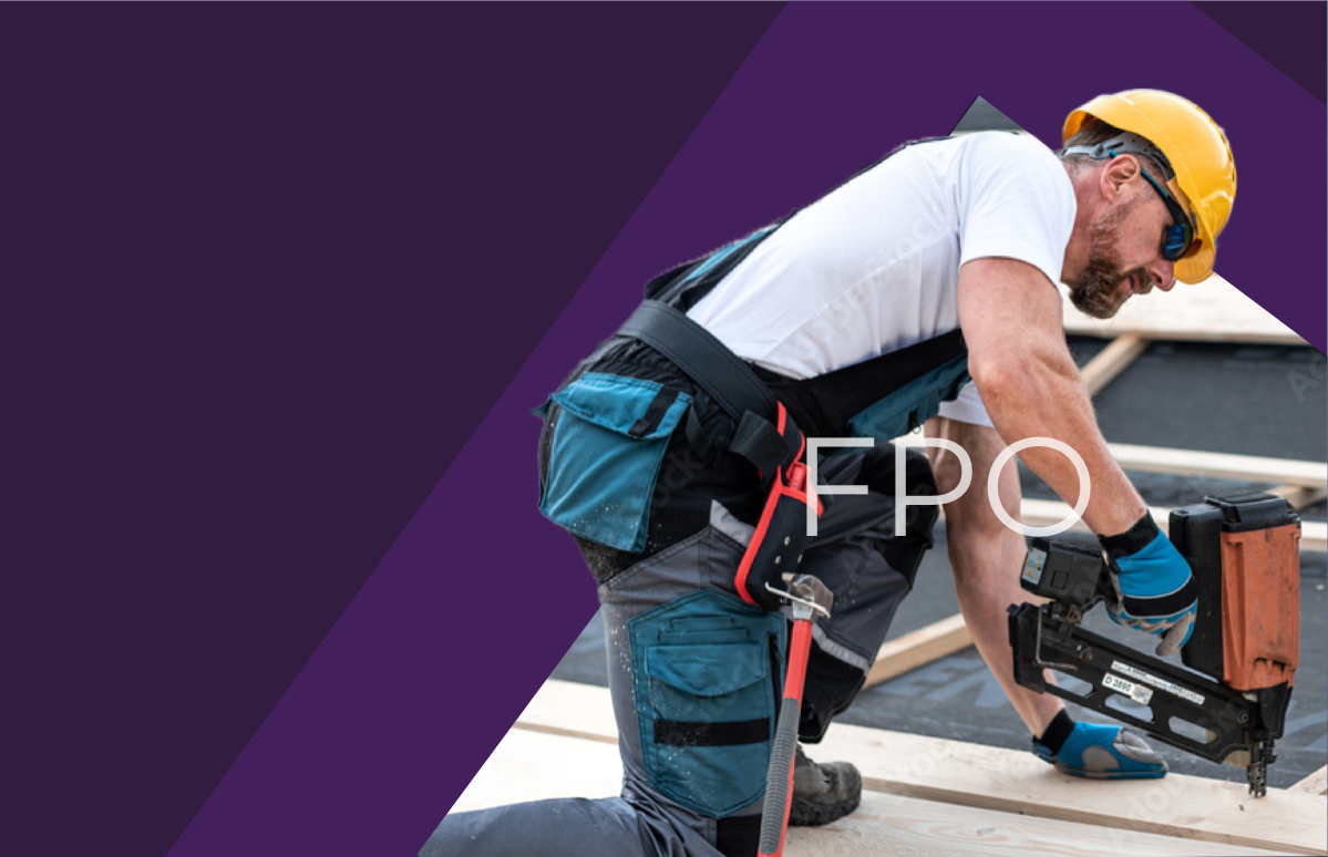 A professional roofer working on a house.