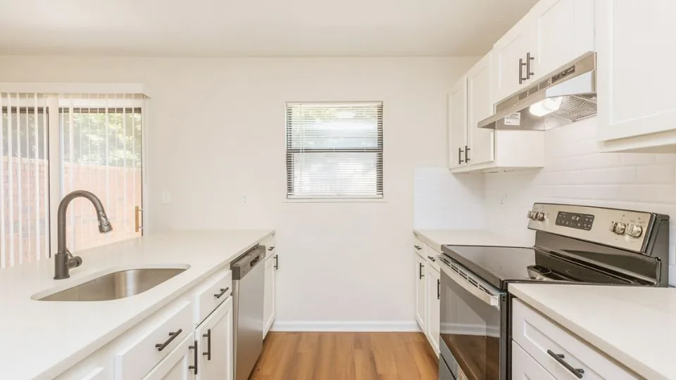 Renovated kitchen with granite countertops at Claxton Pointe