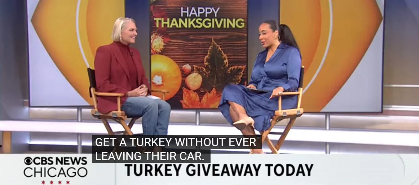 CBS News Chicago Thanksgiving segment on a Turkey Giveaway, featuring an interview between two women against a "Happy Thanksgiving" backdrop. Text overlay reads: "GET A TURKEY WITHOUT EVER LEAVING THEIR CAR. TURKEY GIVEAWAY TODAY."
