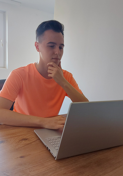 Jovica Filipovic working on a laptop