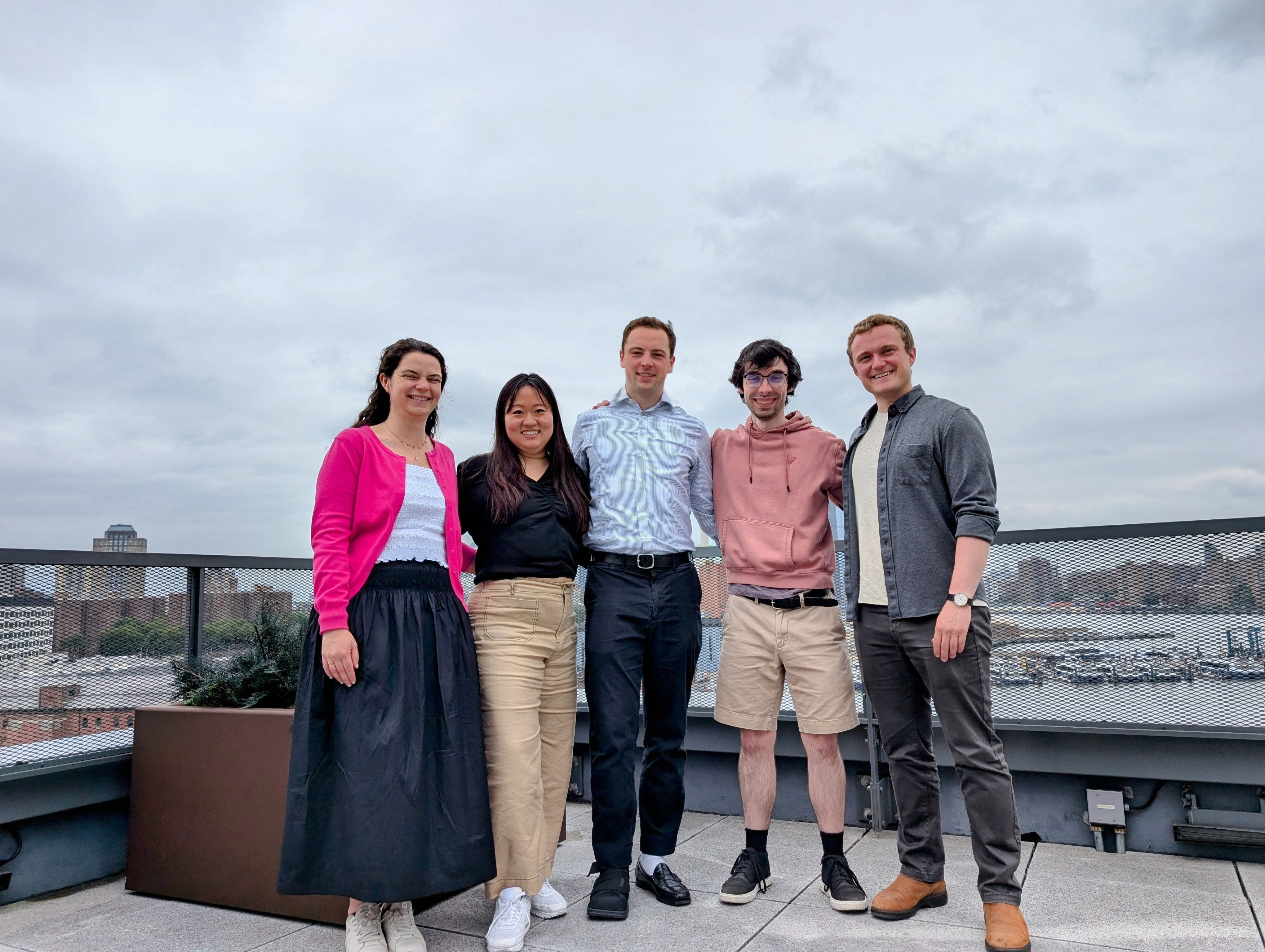 The Holly team standing together on a rooftop, including co-founders Cherie Chung and Brendan Hellweg with summer interns Jack Conlin and Olivia Ott.