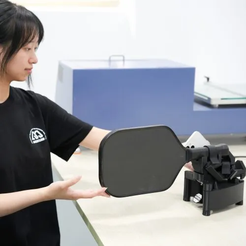 Swing and surface-friction checks on finished pickleball paddles