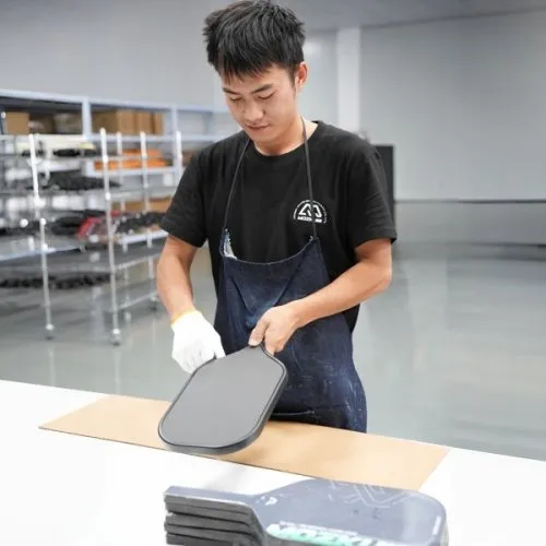 Fitting the edge guard around a pickleball paddle