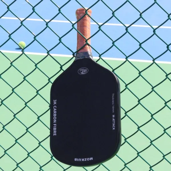 Mozkuib carbon fiber pickleball paddle on a pickleball court