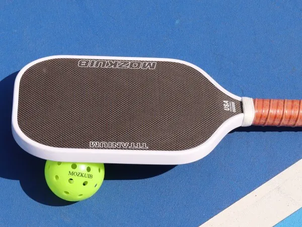 particle-enhanced pickleball paddle surface