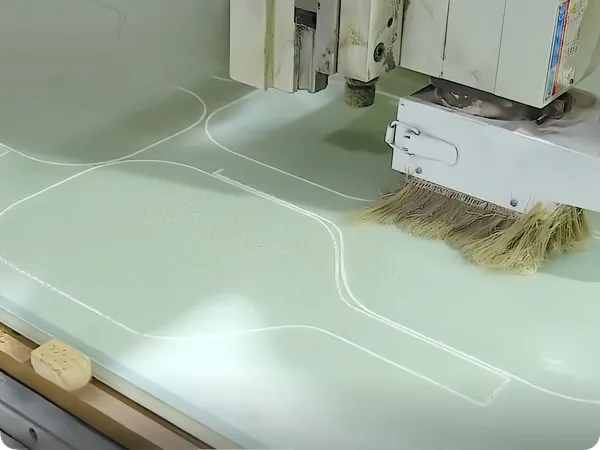 CNC cutting the outline of a cold-pressed pickleball paddle at Mozkuib
