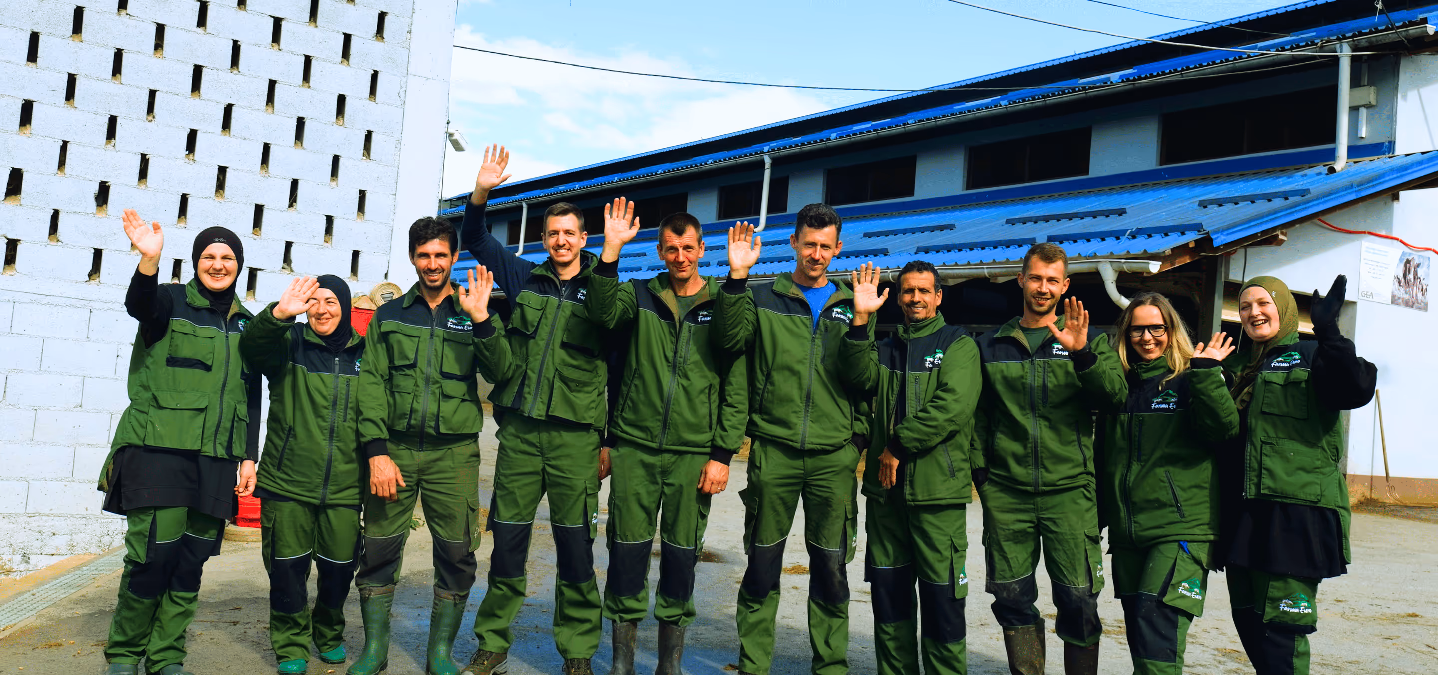 Image of the entire Farma Euro's Team, waving their hands towards the viewer.