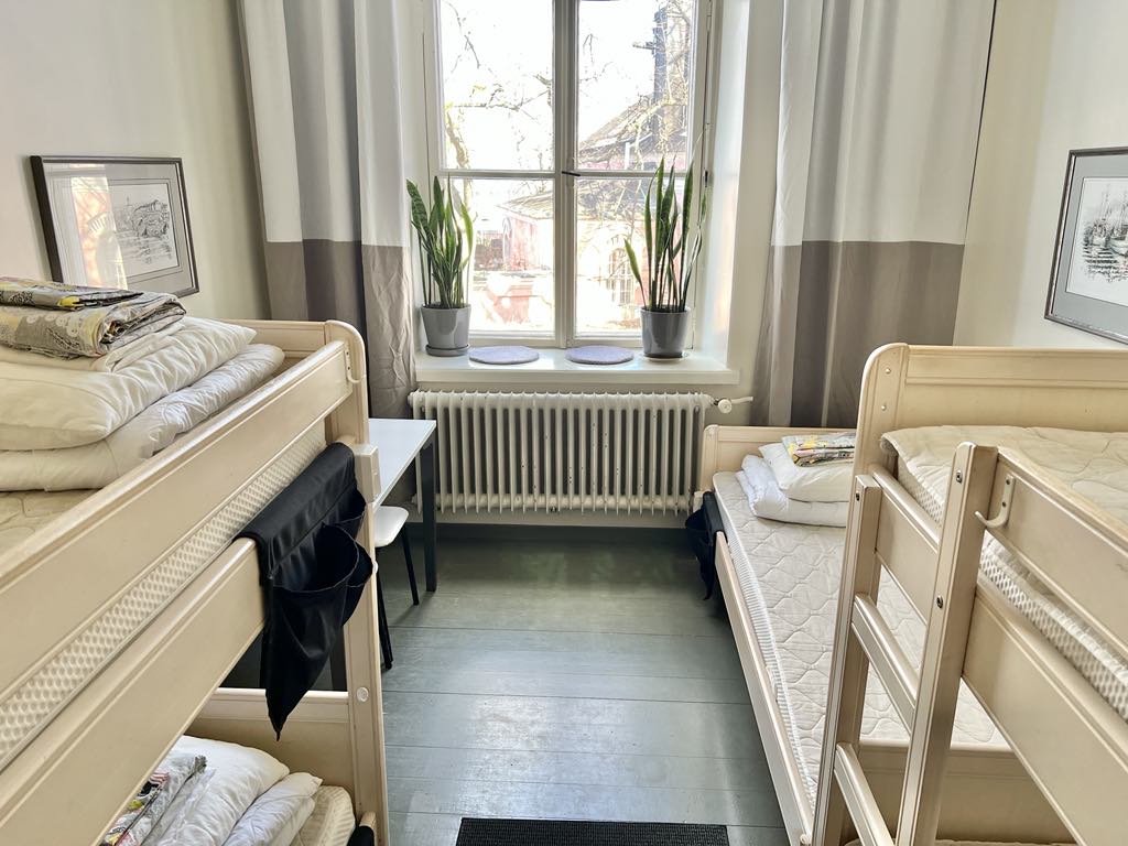 Room with bunk beds and a window