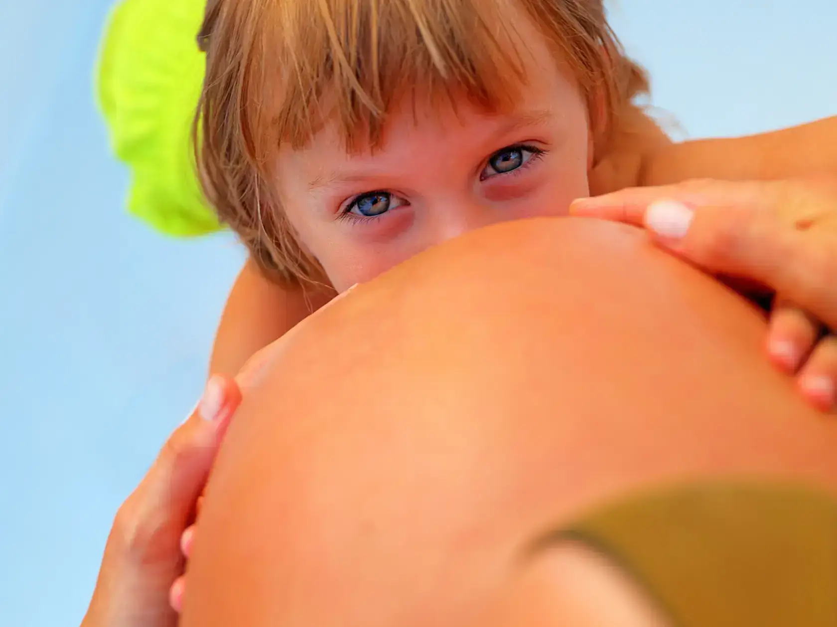 Baby kisses Pregnant mummy