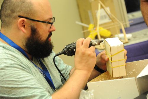 ClueCon Attendee building a contraption for the FreeCYCLED Hack Challenge
