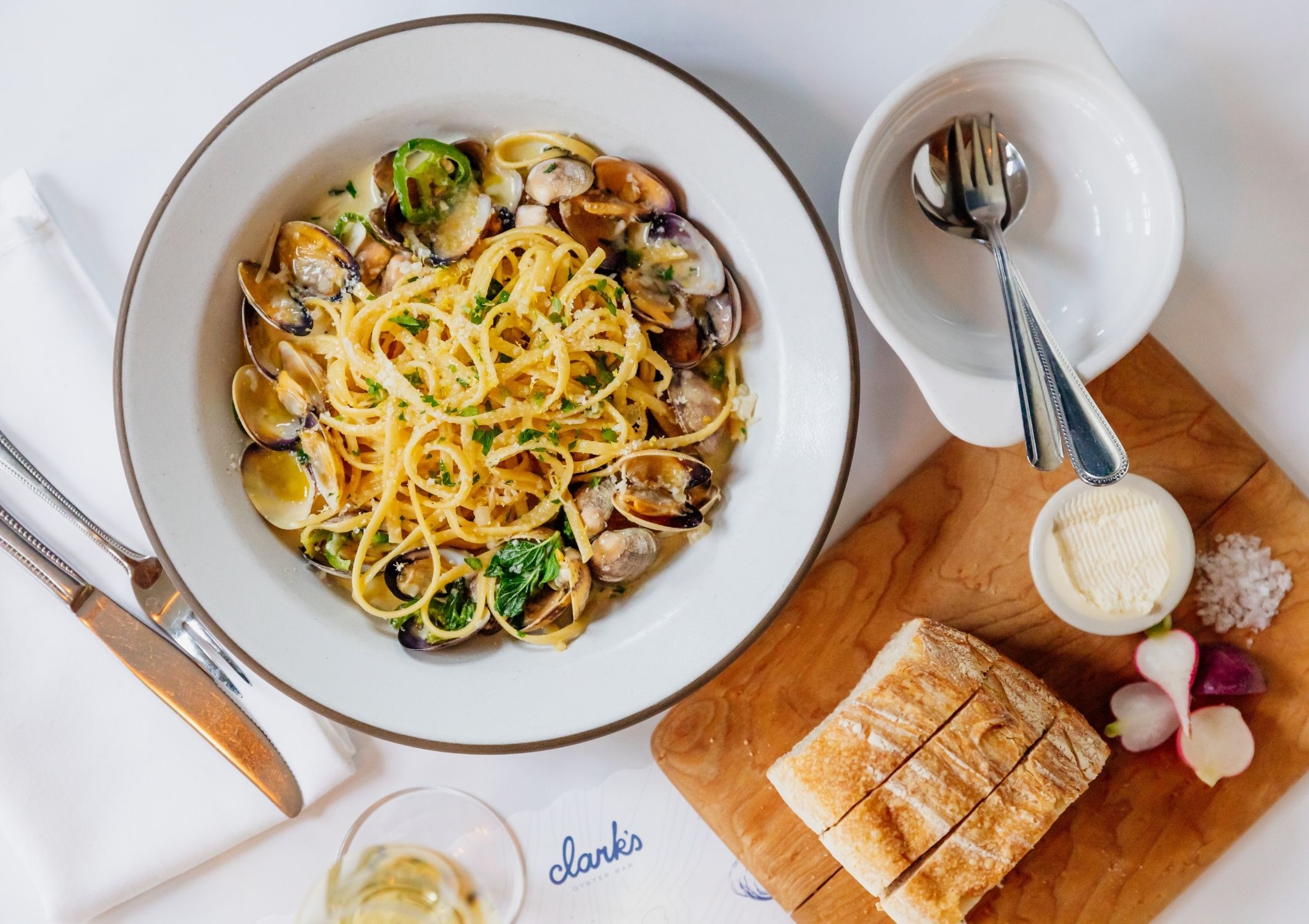 Linguine with clams, and a side of bread with butter and sea salt at Clark's Oyster bar