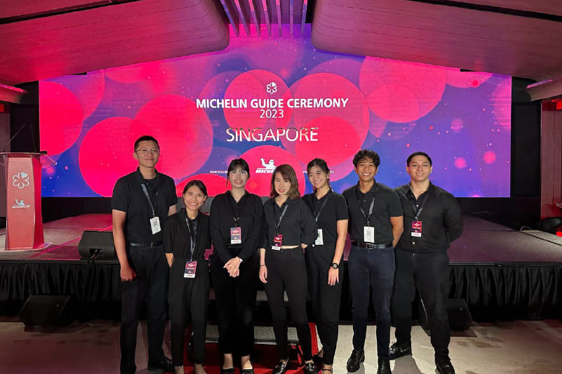 TROOPERS team standing in front of the TROOPERS logo during the company's founding in July 2017