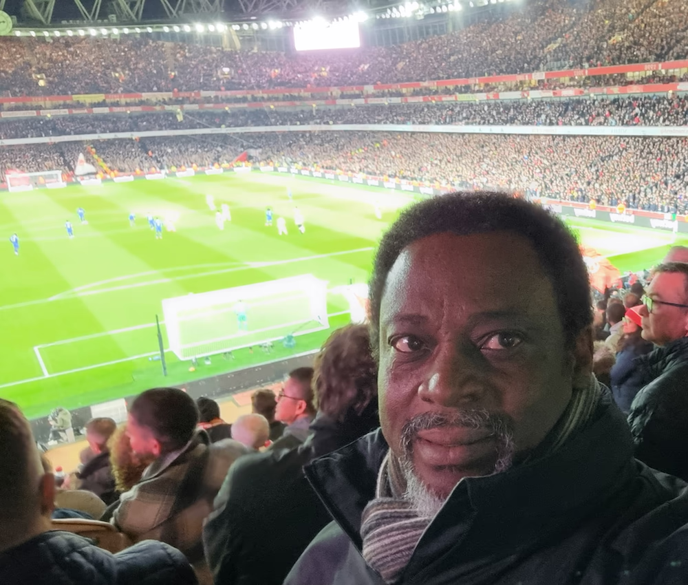 This photo shows me at the Emirates stadium, enjoying the thrilling atmosphere while watching my favourite team, Arsenal, play.