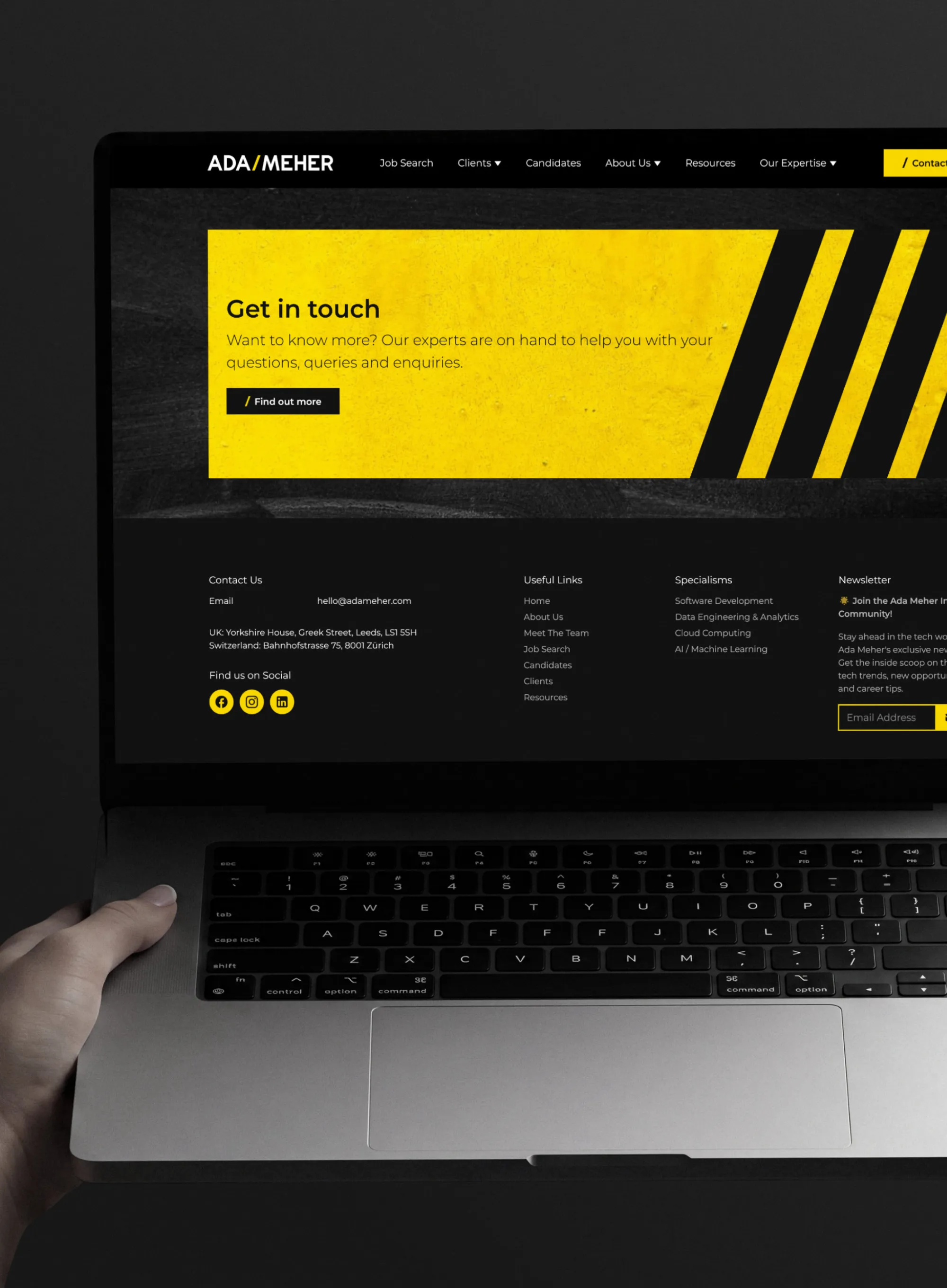 The homepage for the Minds Eye website displayed on a laptop
