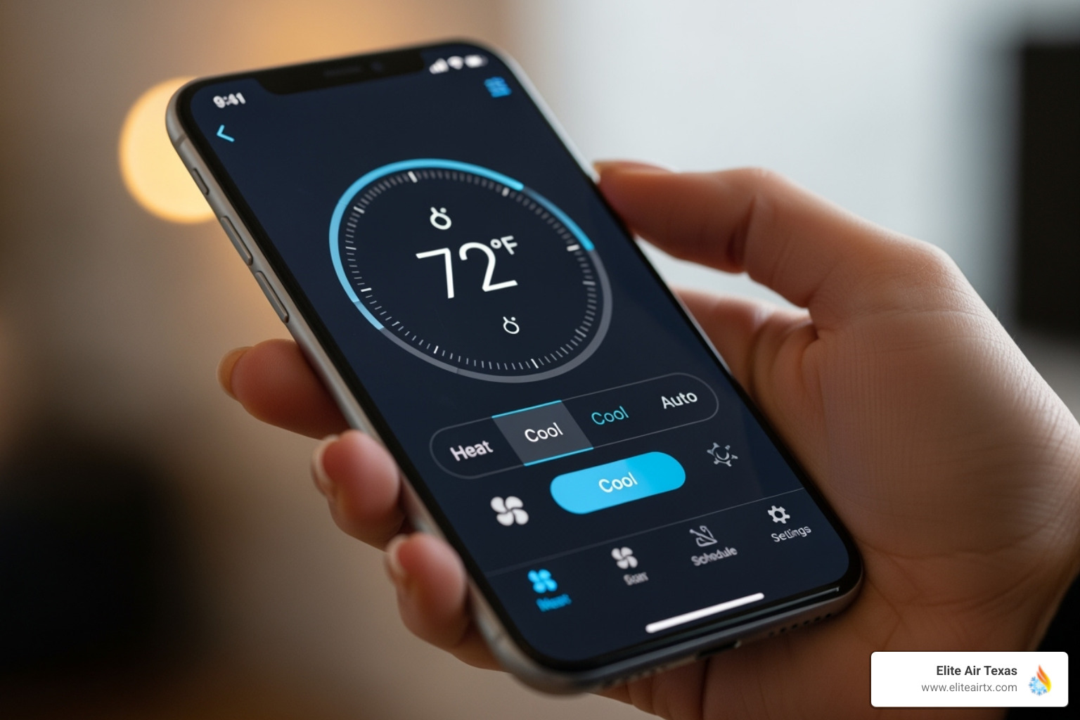 A hand holding a smartphone displaying a thermostat control app with temperature settings - programmable thermostat mckinney