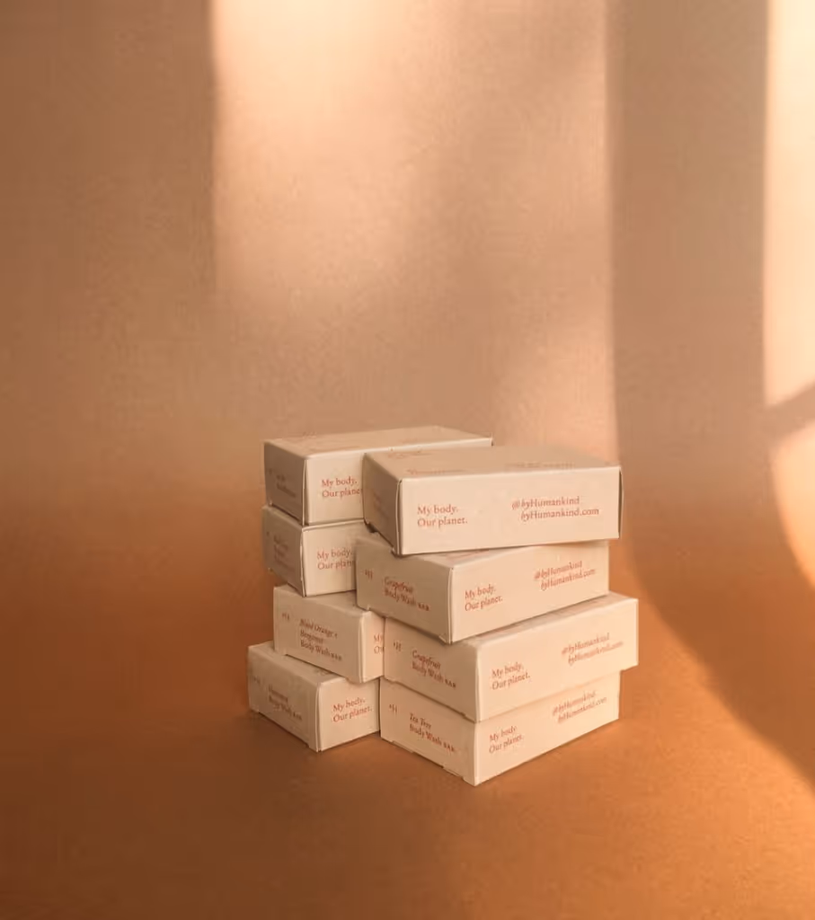 Image featuring skincare products from the brand 'by Humankind'. The photograph showcases a range of sustainable and eco-friendly skincare items. The products include cleansers, moisturizers, serums, and masks, all thoughtfully displayed in clean and minimalistic packaging. The brand's logo, 'by Humankind,' is prominently visible, reflecting their commitment to creating environmentally conscious skincare solutions. The image embodies a modern and eco-friendly aesthetic, enticing users to explore the sustainable offerings of 'by Humankind'.