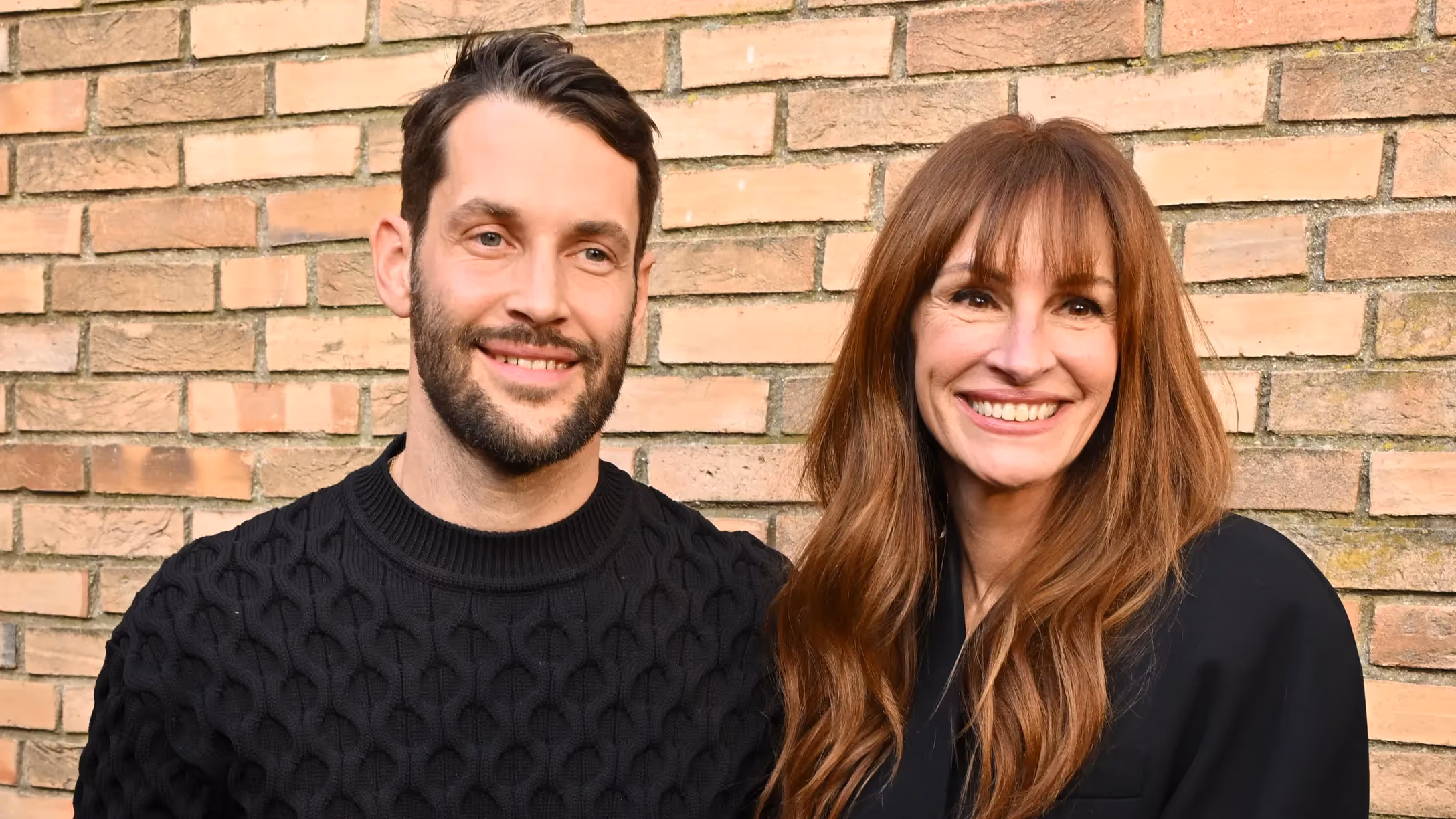 Portrait of Simon Porte Jacquemus, young French fashion designer, looking thoughtful. His expression conveys reflection on his career and the lessons learned from influential designer Rei Kawakubo.