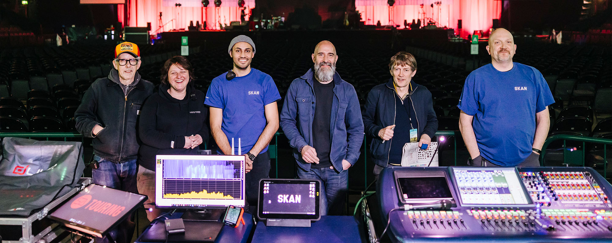 James Blunt's audio crew standing with the stage in the background