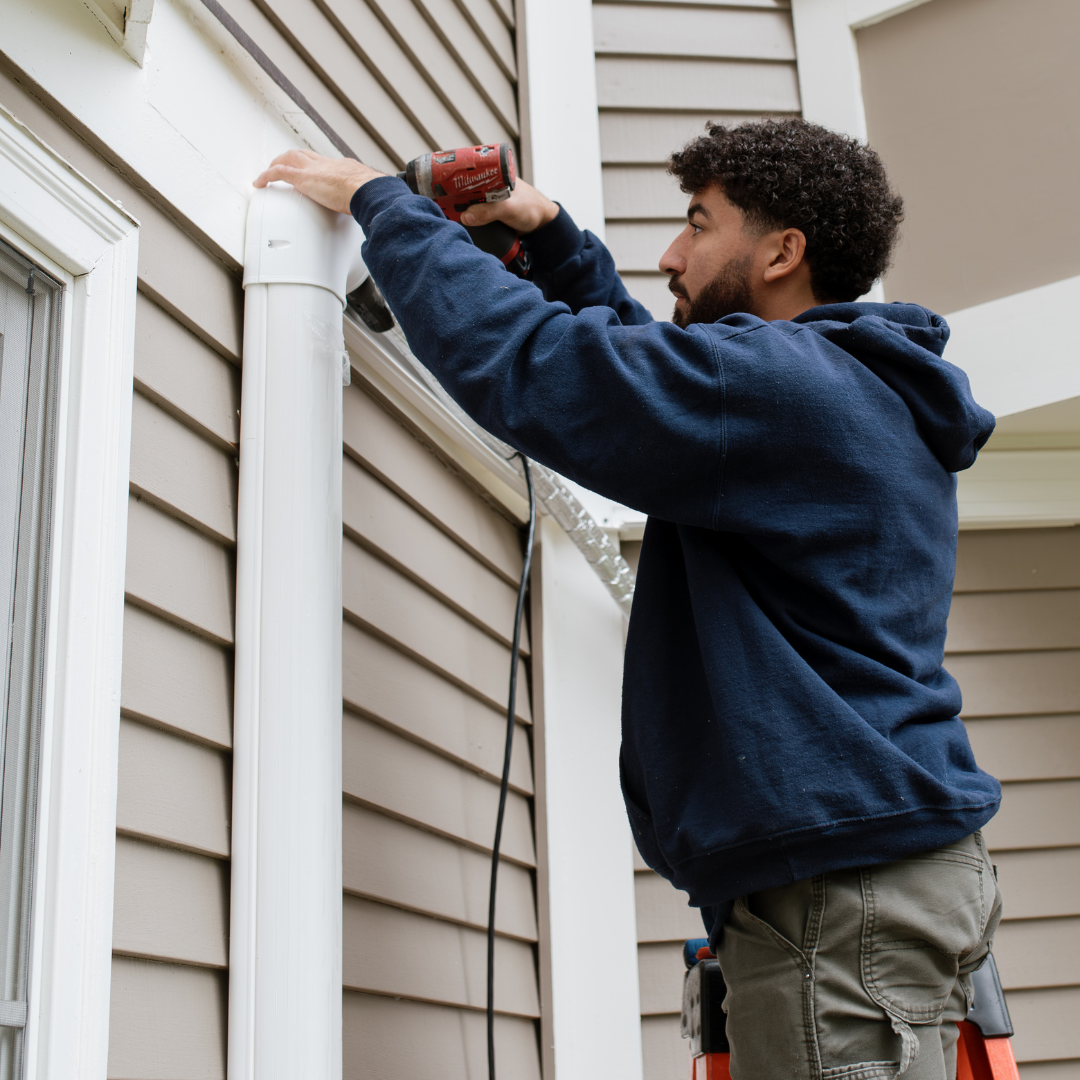 Forge team members installing ductwork in a home in Massachusetts