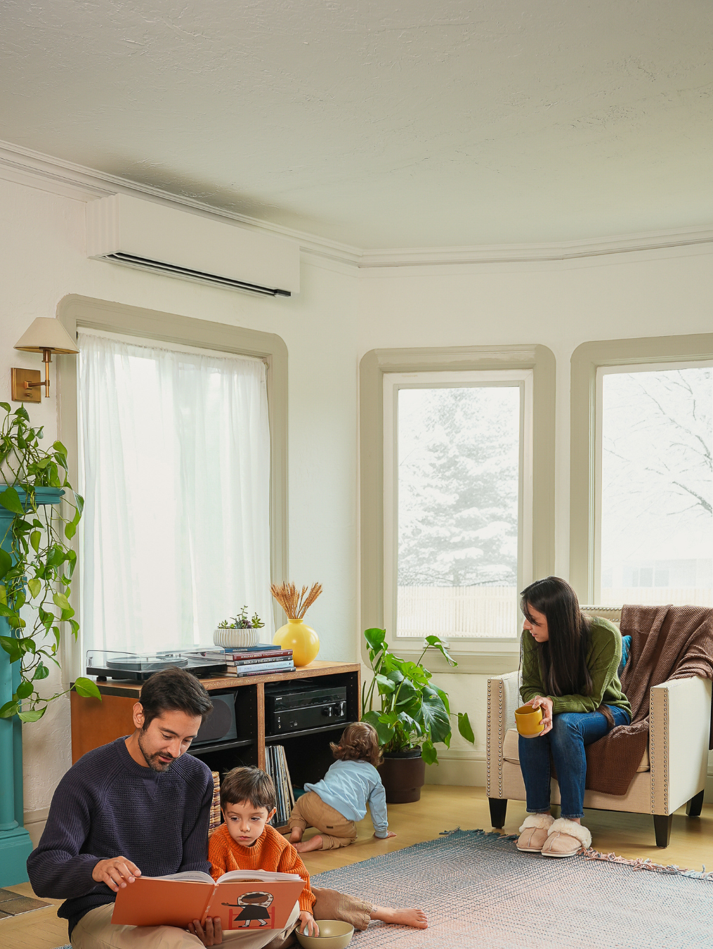 Child playing in front of a Quilt wall head