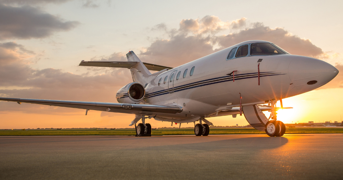 Business Jet on Ramp with Sun in Background