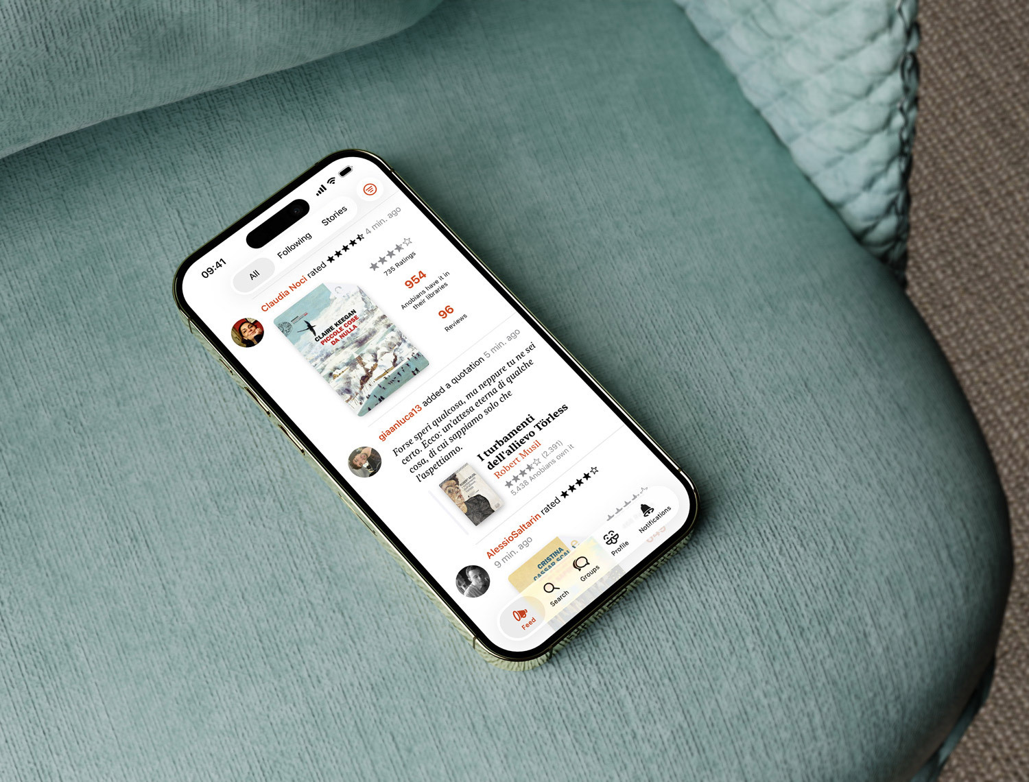 Tha Anobii app's home screen, displayed on an iPhone laid on a sofa.