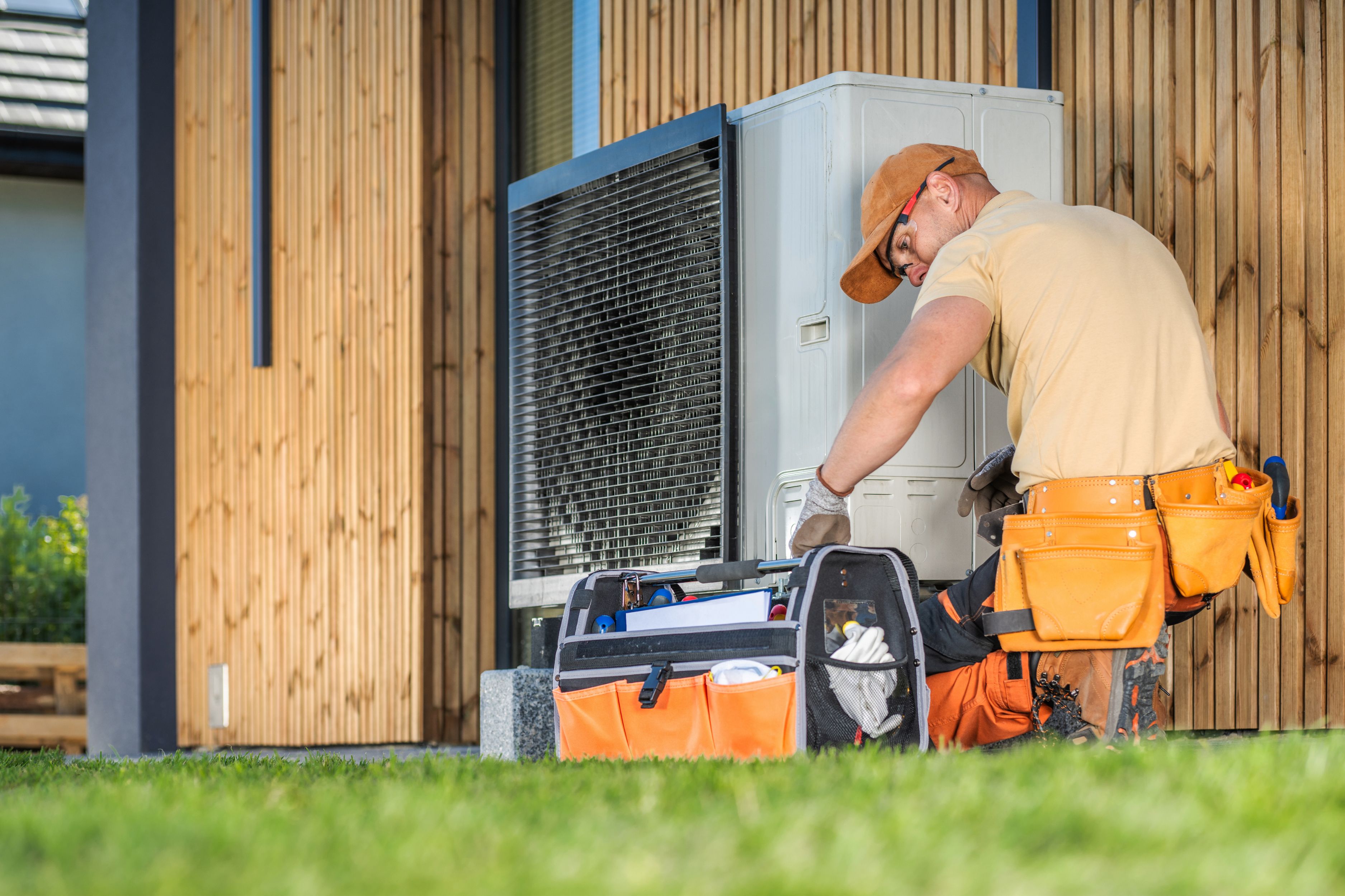 HVAC technician installing new heating and cooling system