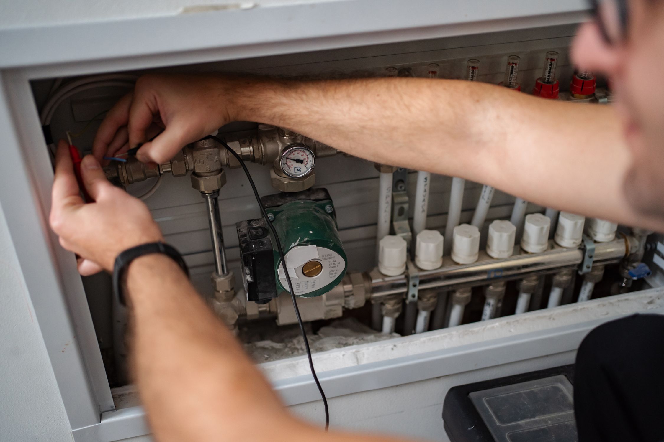 Technician replacing air filter in HVAC system
