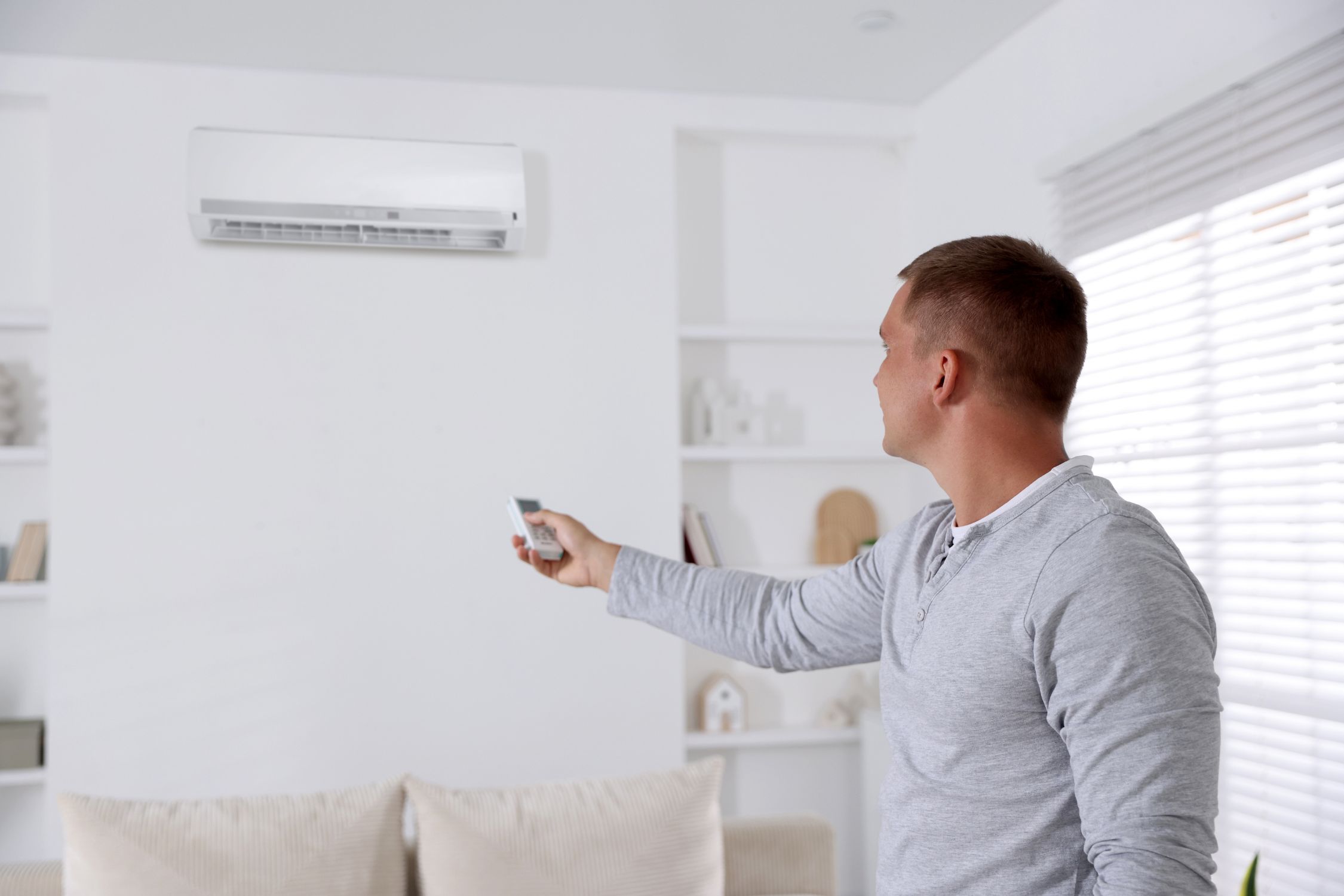 Technician installing smart home HVAC control system in Athens, GA home