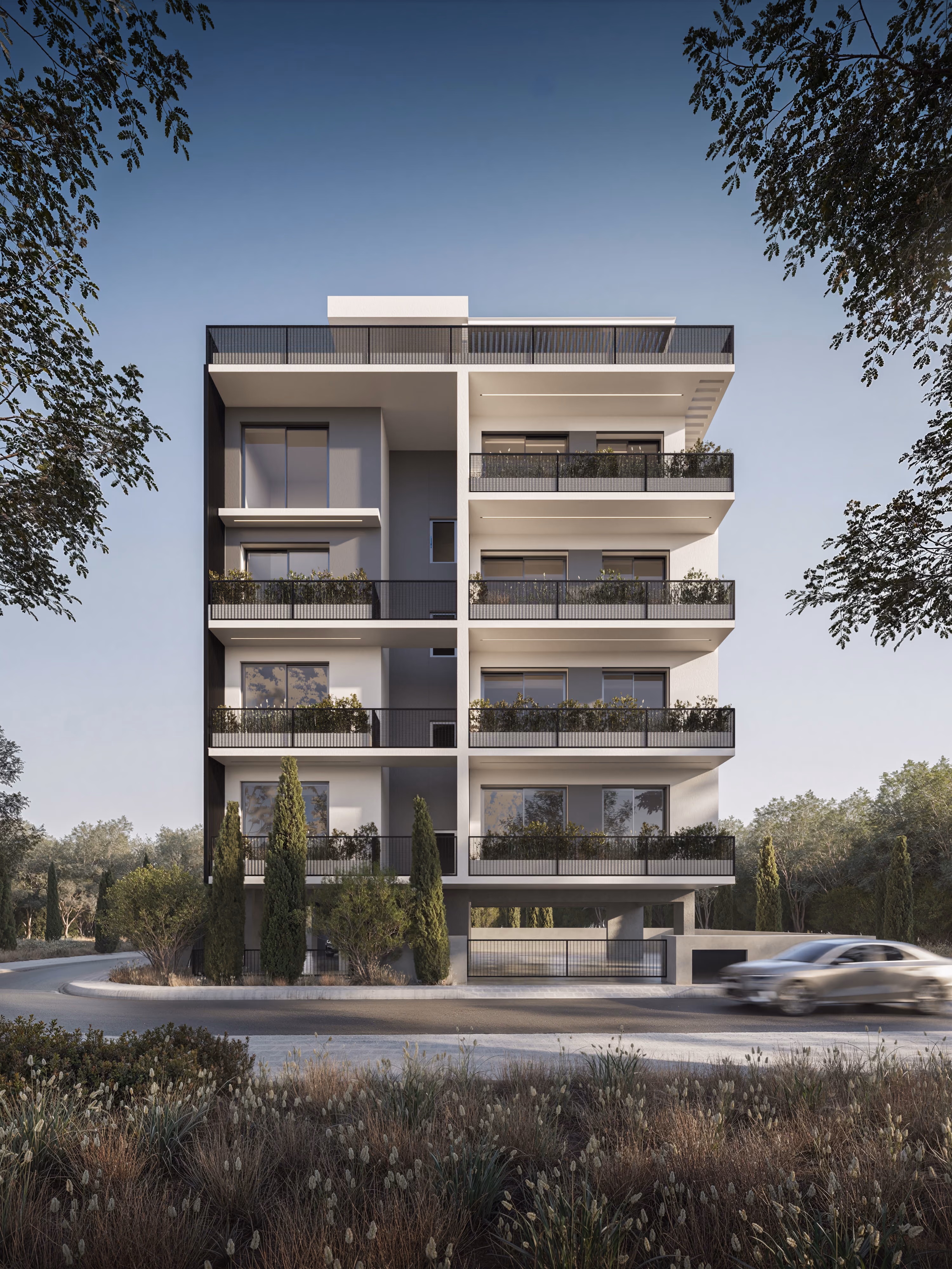 *Fragment is a modern four-story concrete building with balconies adorned with green plants and a silver sports car parked on the street in front.