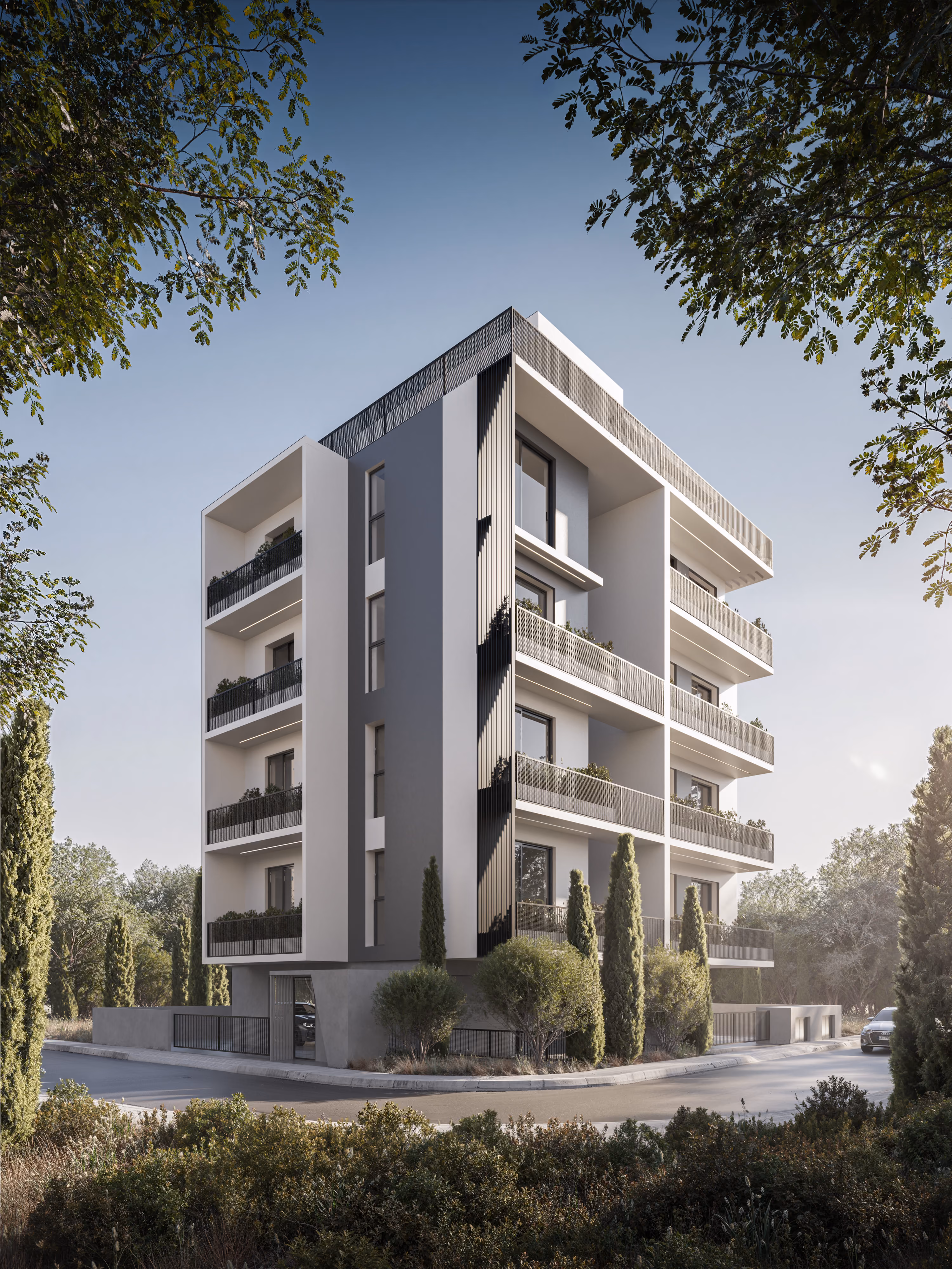 *Fragment is a modern four-story concrete building with balconies adorned with green plants and a silver sports car parked on the street in front.