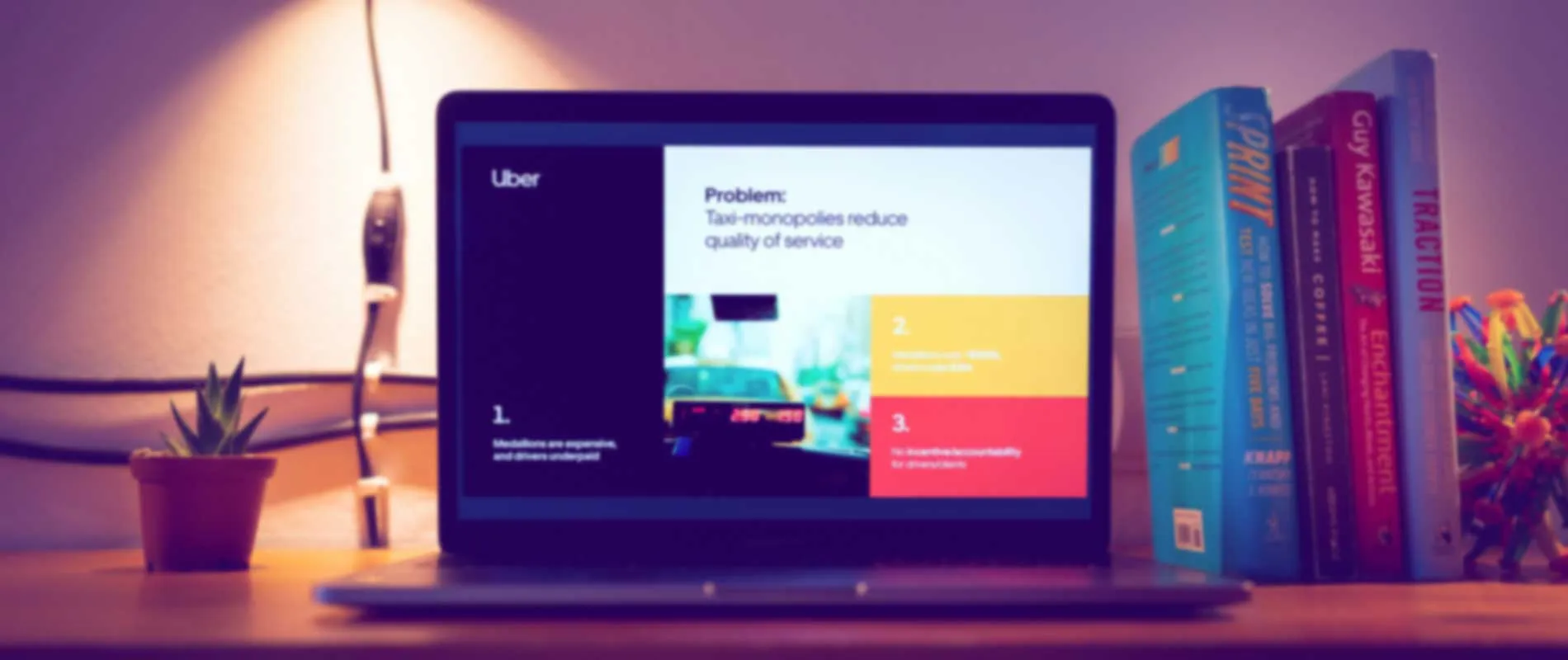 Laptop on desk displaying a presentation slide titled 'Problem: Taxi-monopolies reduce quality of service' with a small potted plant on the left and a row of books on the right.