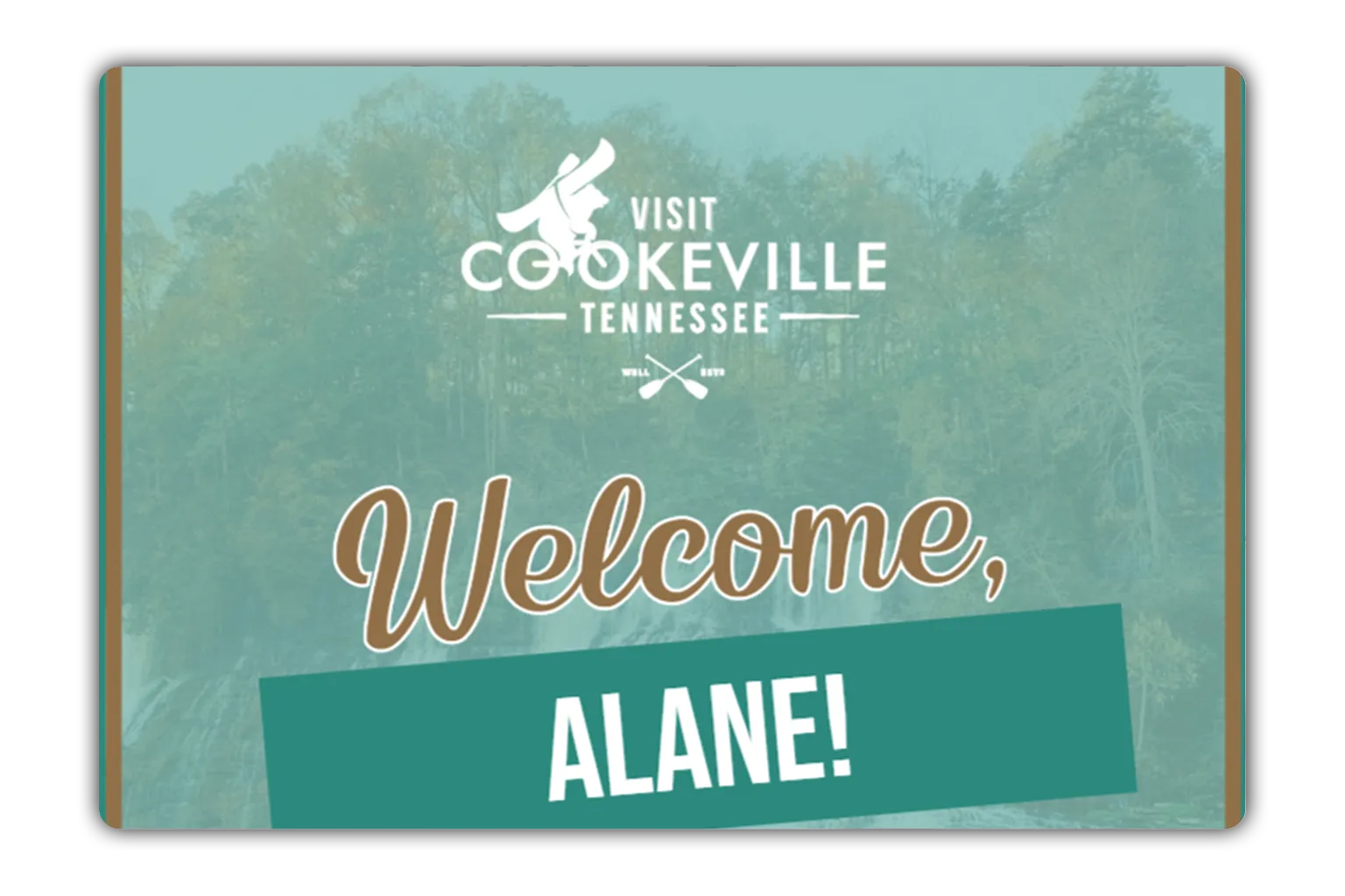 Welcome sign for Visit Cookeville Tennessee with a background of forested hills.