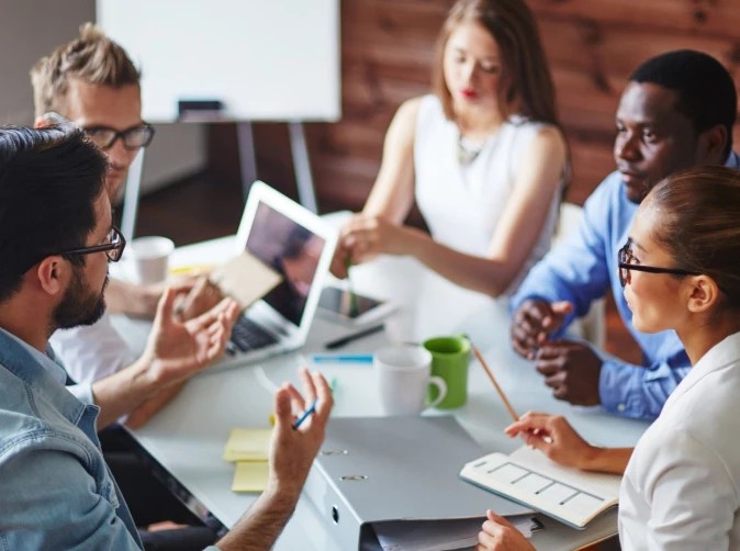 Team conducting show-and-tell workshops to refine project scope and requirements